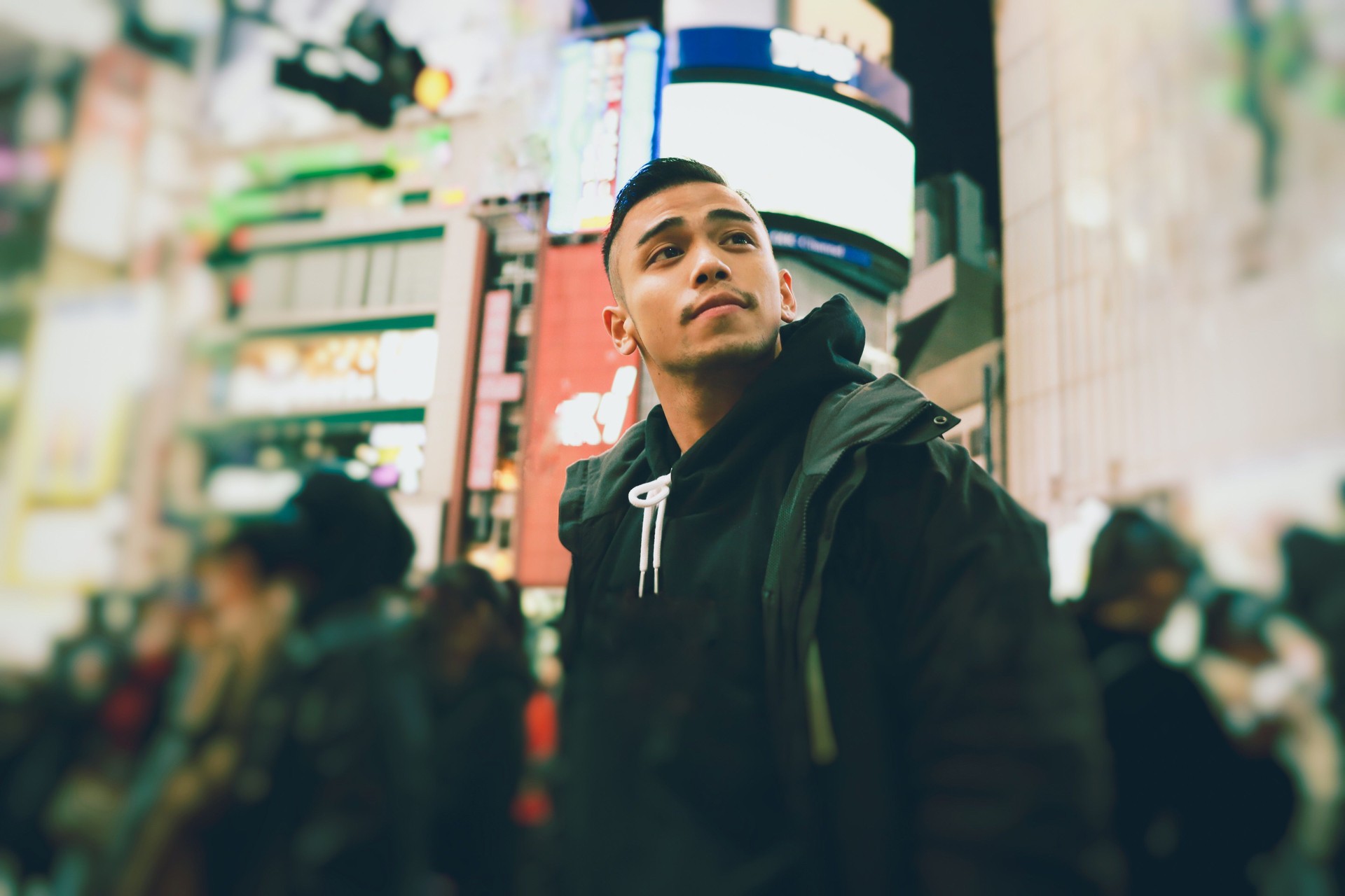 Portrait of young man at the night time in Tokyo