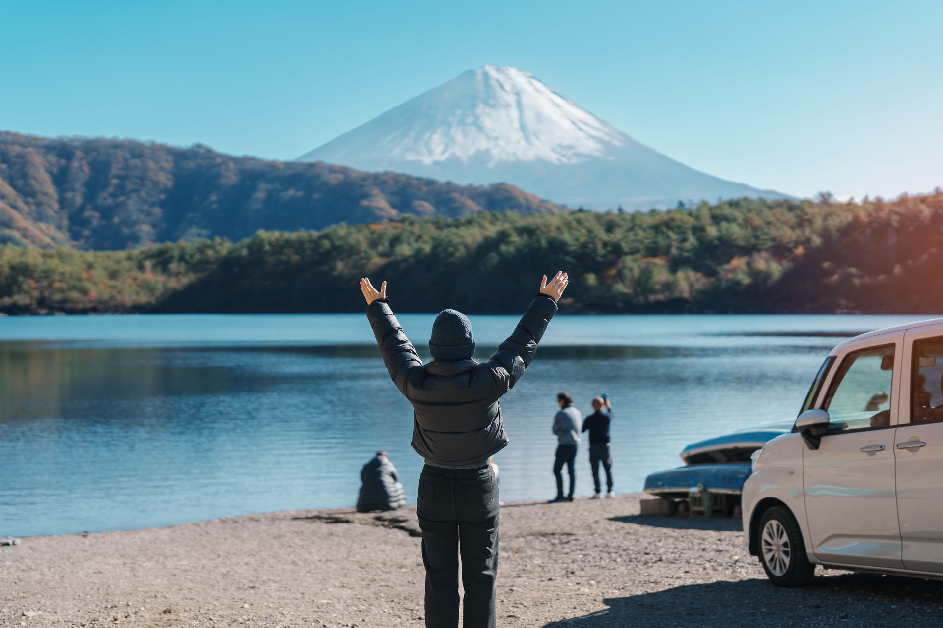 Woman tourist enjoy with Fuji Mountain at Lake Saiko, happy Traveler sightseeing Mount Fuji and road trip Fuji Five Lakes. Landmark for tourists attraction. Japan Travel, Destination and Vacation
